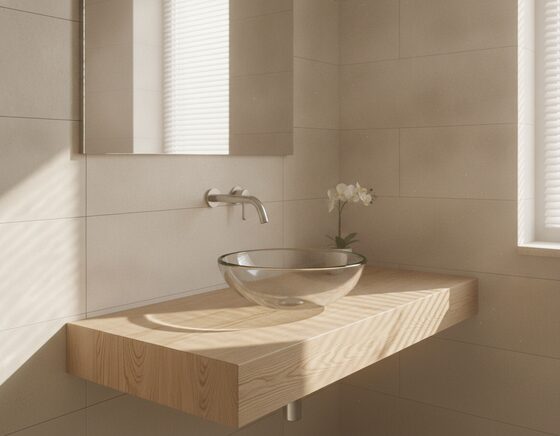 Clear glass vessel basin on a timber vanity top