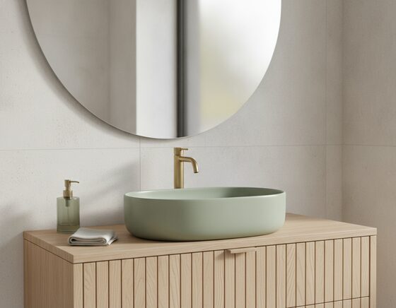 Sage green ceramic basin on a timber vanity